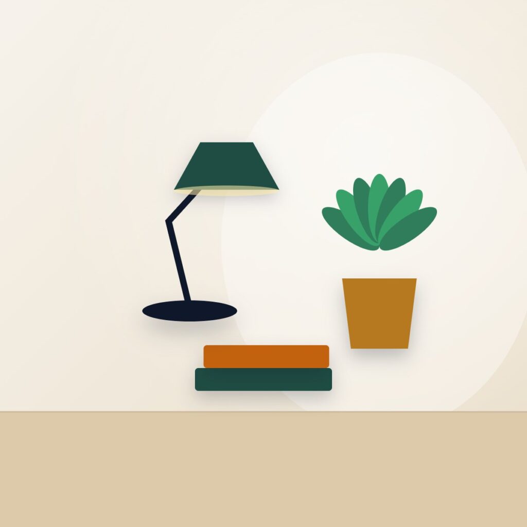 Books, a lamp and a plant in the design studio